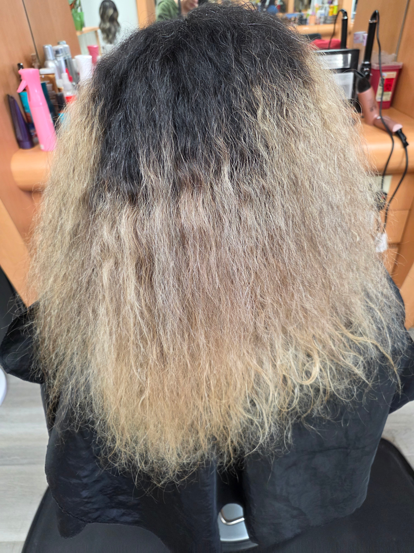 Before photo of grown-out blonde hair before salon blonde refresh